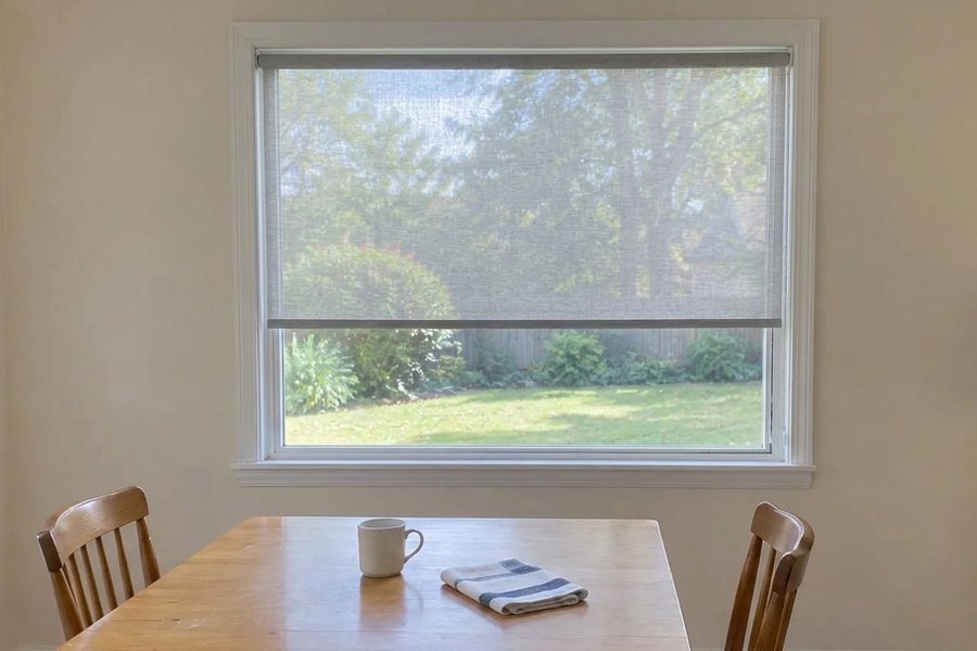 Gray light filtering roller shade visualized on a breakfast nook window with DecorViz