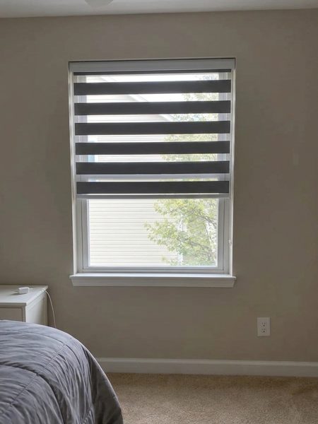 Gray zebra shade visualized on a real bedroom window using DecorViz