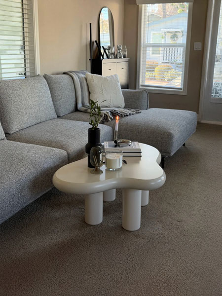 DecorViz coffee table visualizer showing a coffee table placed in a real living room photo